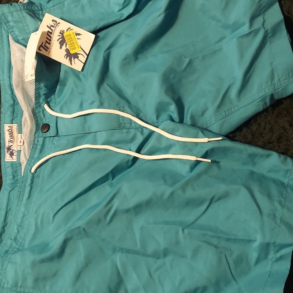 Great poolside blue swim trunks by trunks surf and swim. New with tags